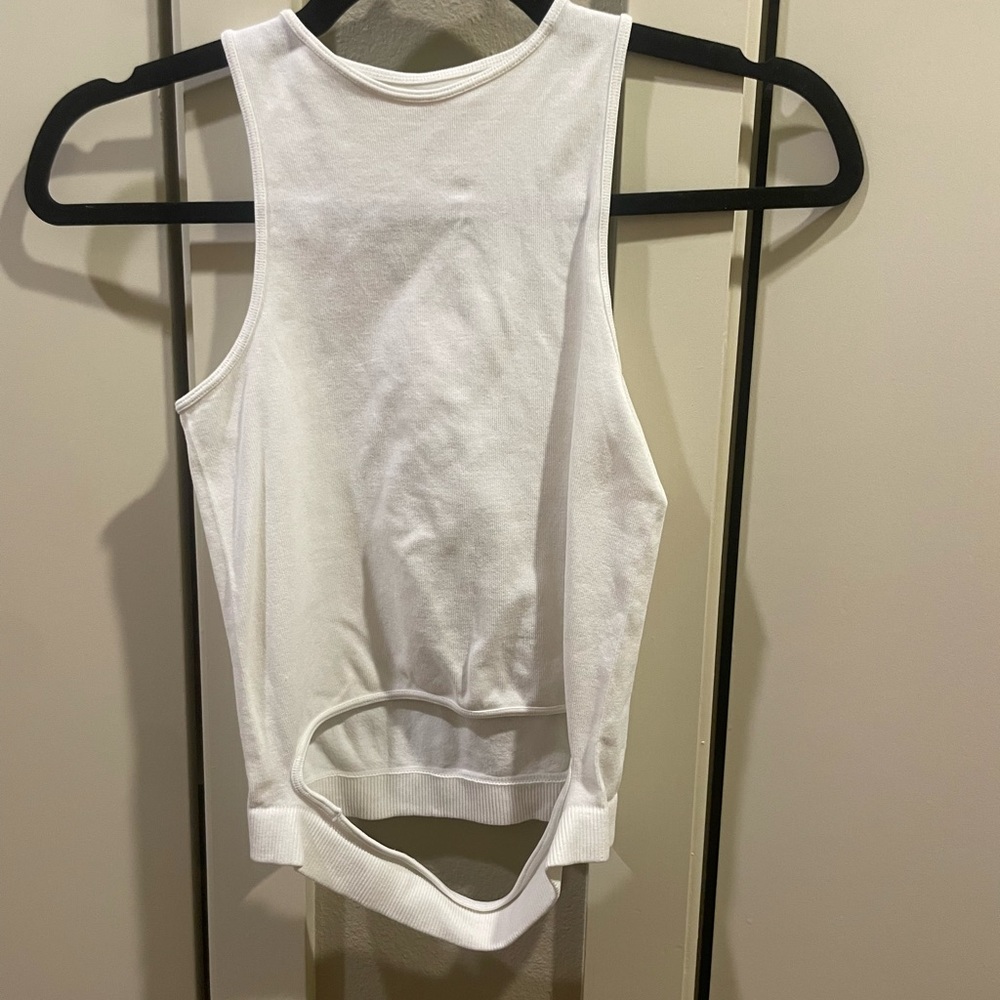 Mixologie white sleeveless top. Size S. Stretchy so could fit almost any size.